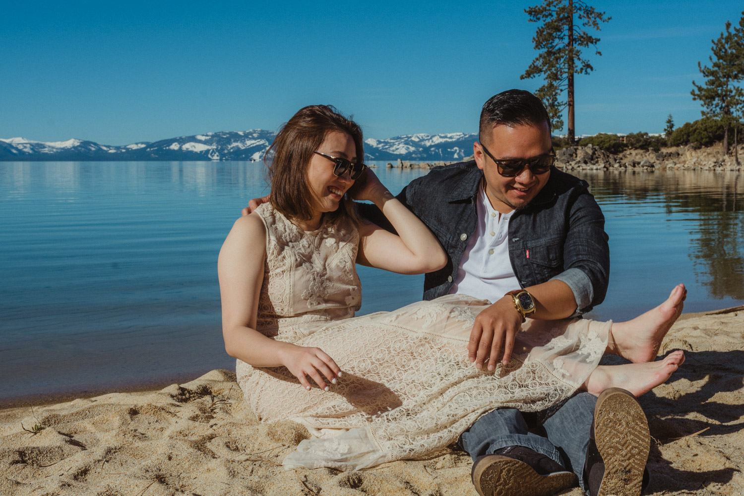 Lake Tahoe engagement session couple playing in the sand photo