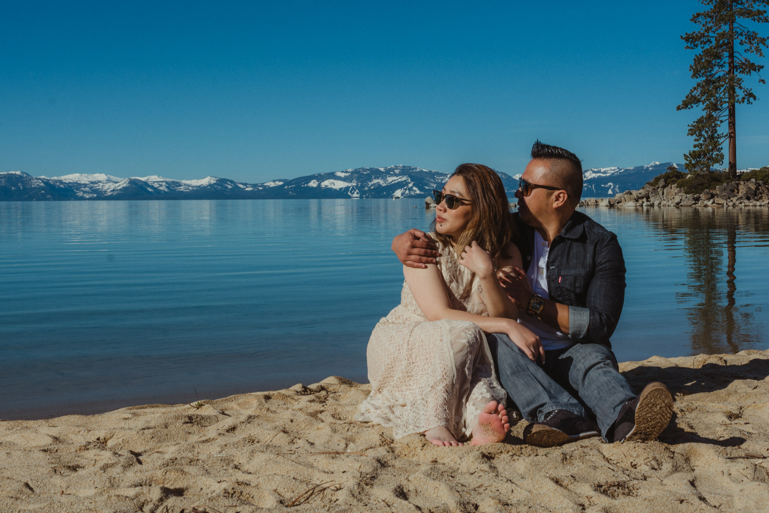 Lake Tahoe engagement session couple looking towards the lake photo 