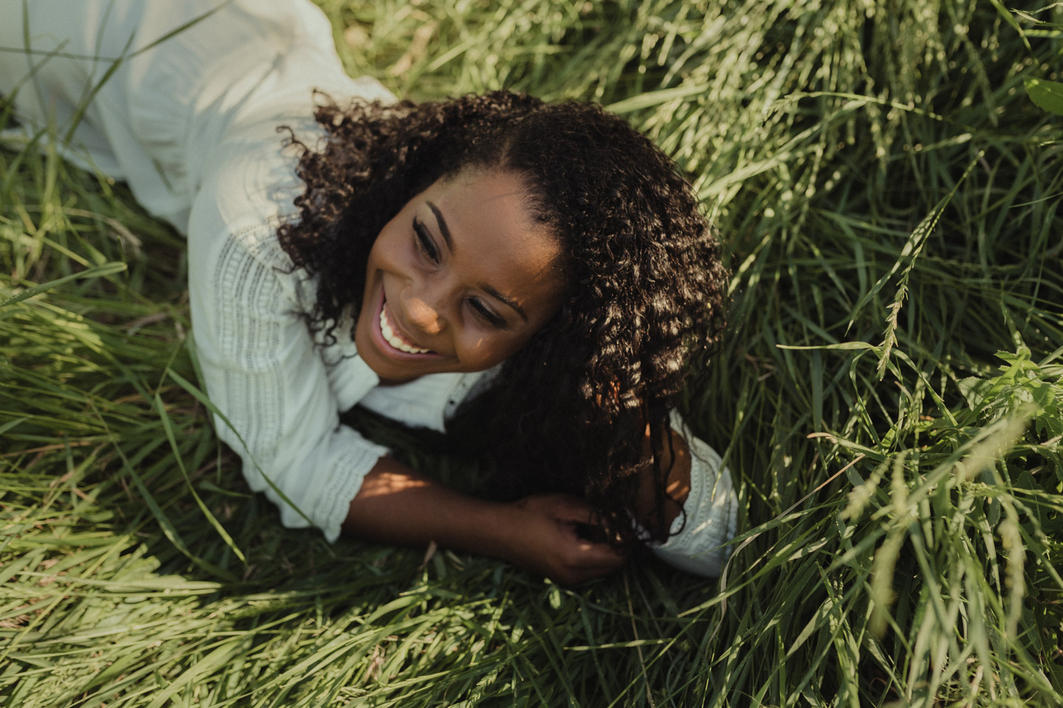 Reno senior photography, girl laughing on the grass photo.