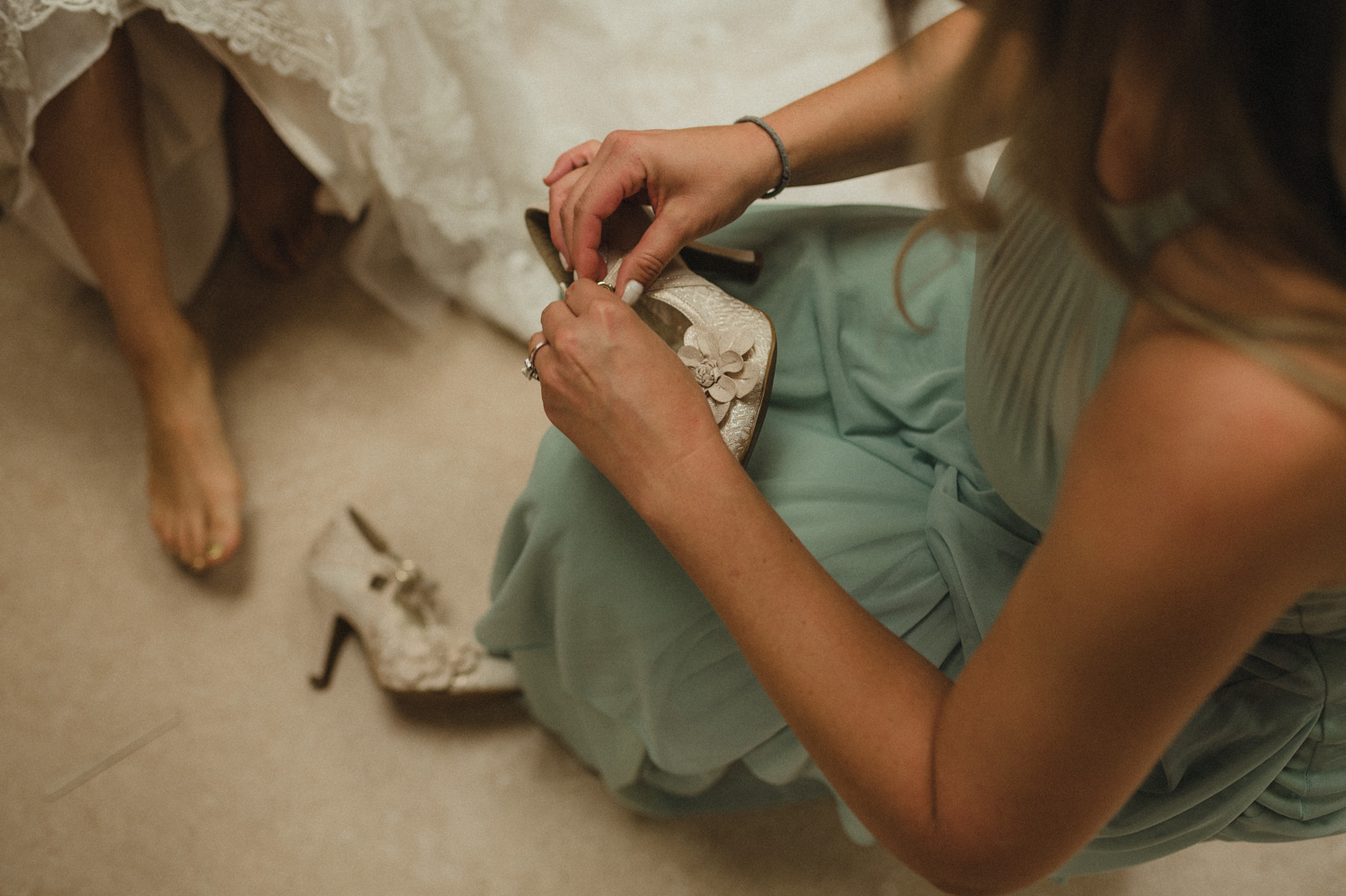 Wilbur D May Museum wedding bride putting on her wedding shoes photo