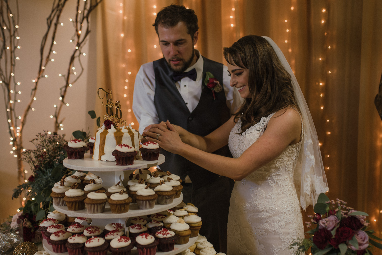 Wilbur D May Museum wedding, couple cutting their Beauty and the Beast cake photo