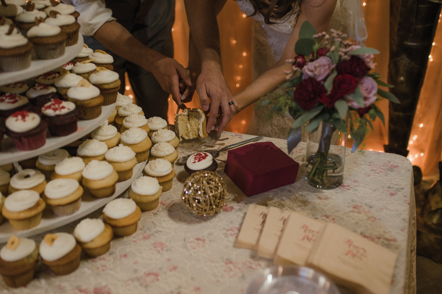 Wilbur D May Museum wedding, couple placing the sliced cake on a plate photo