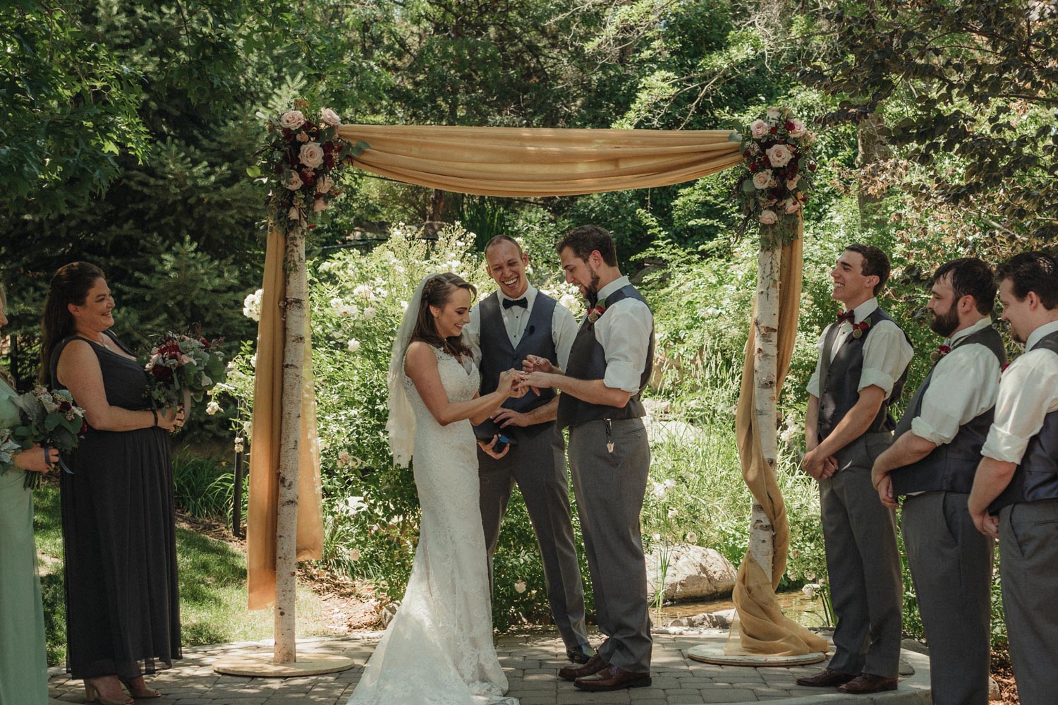 Wilbur D May Museum wedding, bride and groom exchanging rings photo