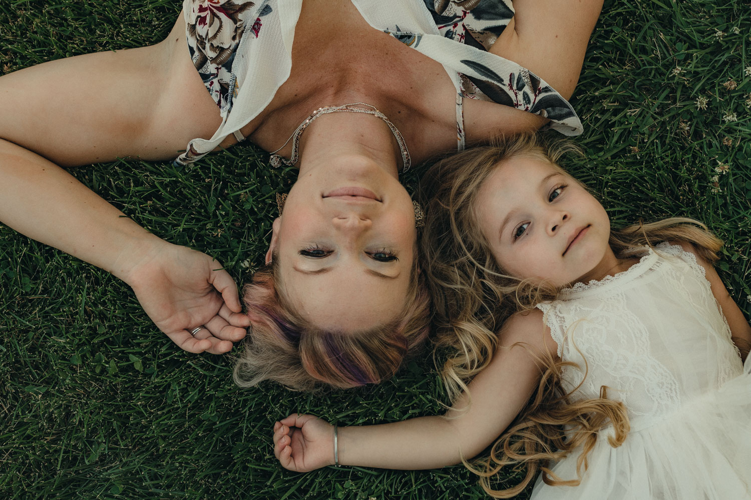 Rancho San Rafael Regional Park photo session, mom and daughter laying on the ground together photo