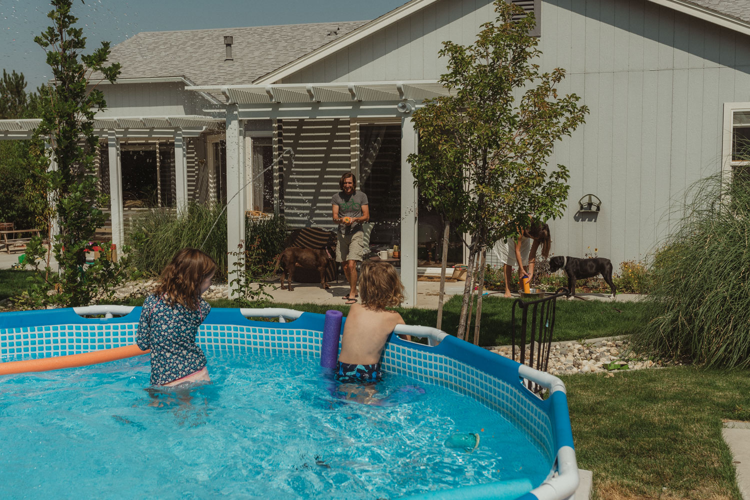 Reno home session kids playing in the pool photo