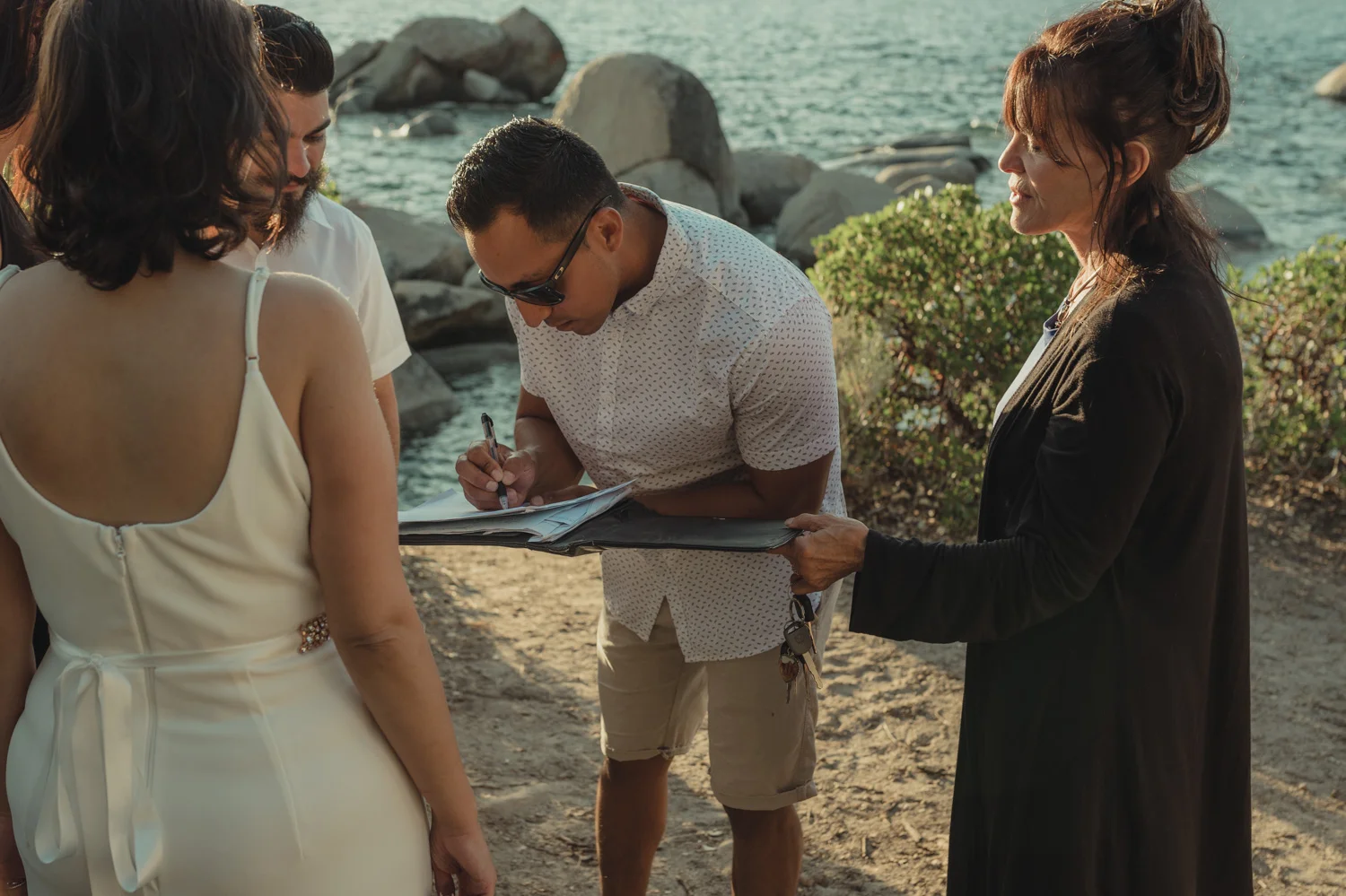 Lake Tahoe elopement signing legal papers photo