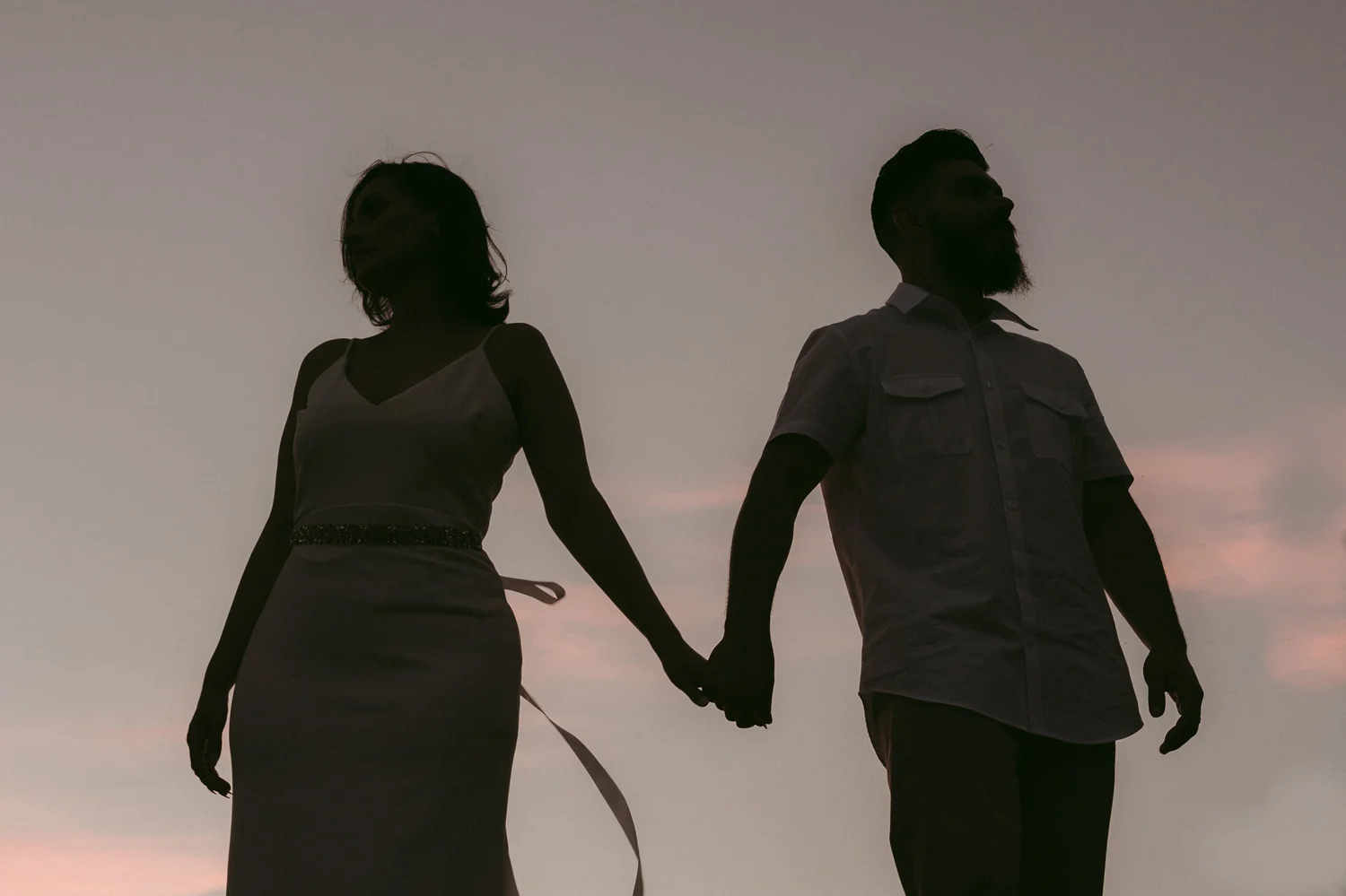 Lake Tahoe elopement couple holding hands during sunset photo