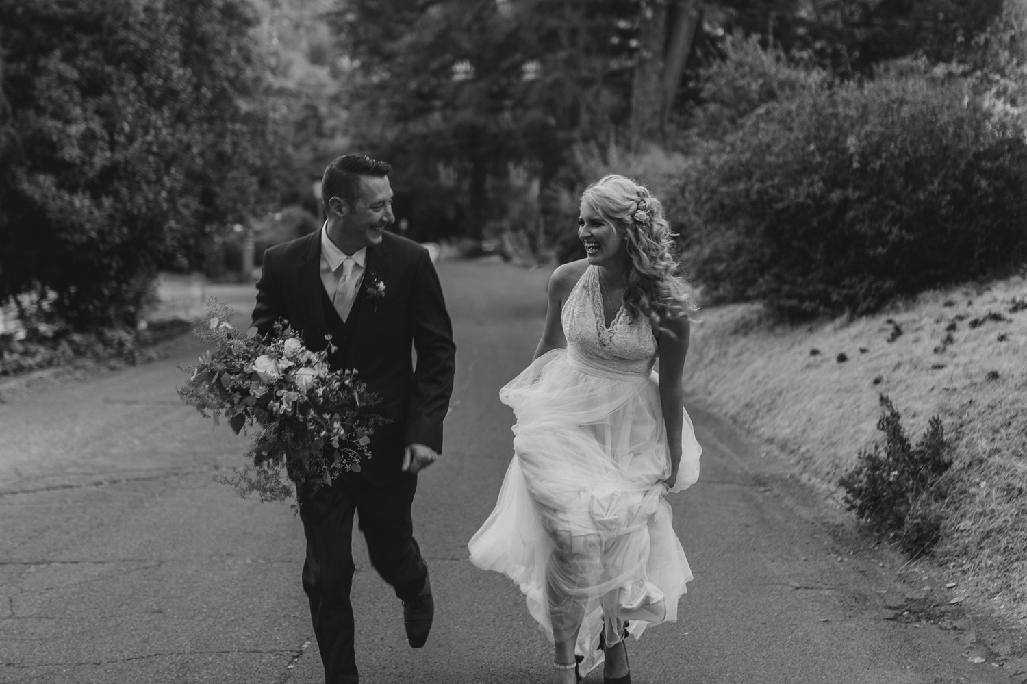Wedgewood Sequoia Mansion wedding couple running up the hill photo