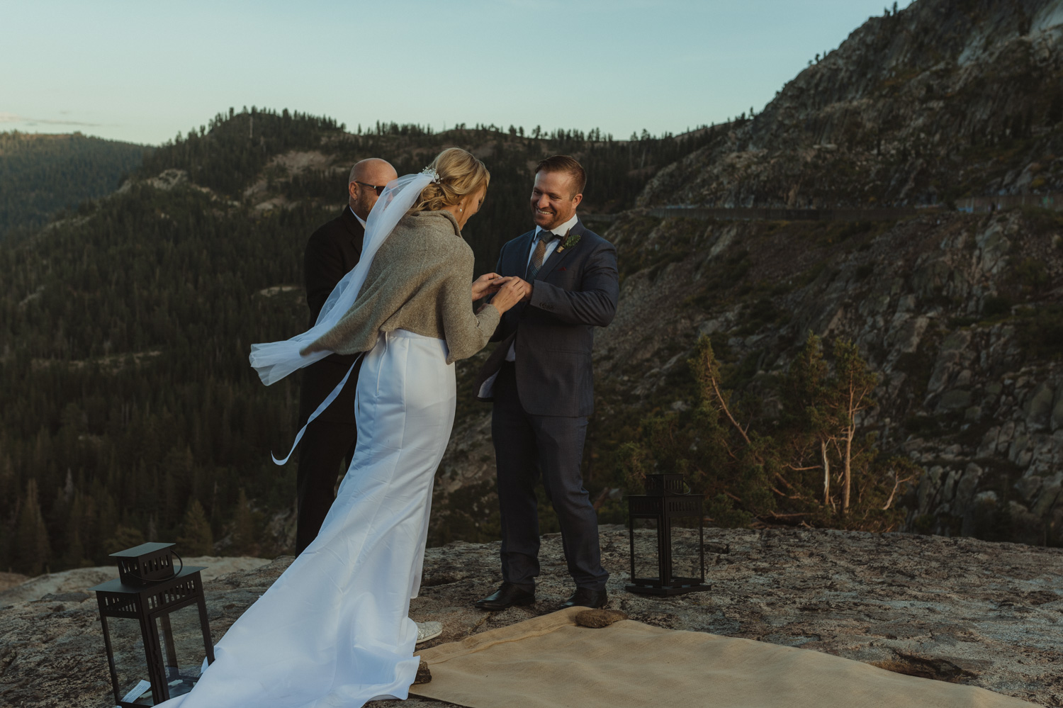 North Lake Tahoe wedding bride putting ring on grooms finger photo