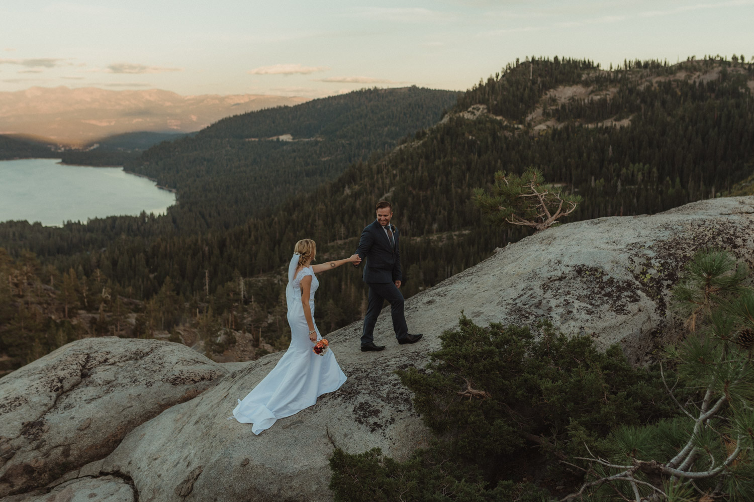 North Lake Tahoe wedding couple walking up a rock photo