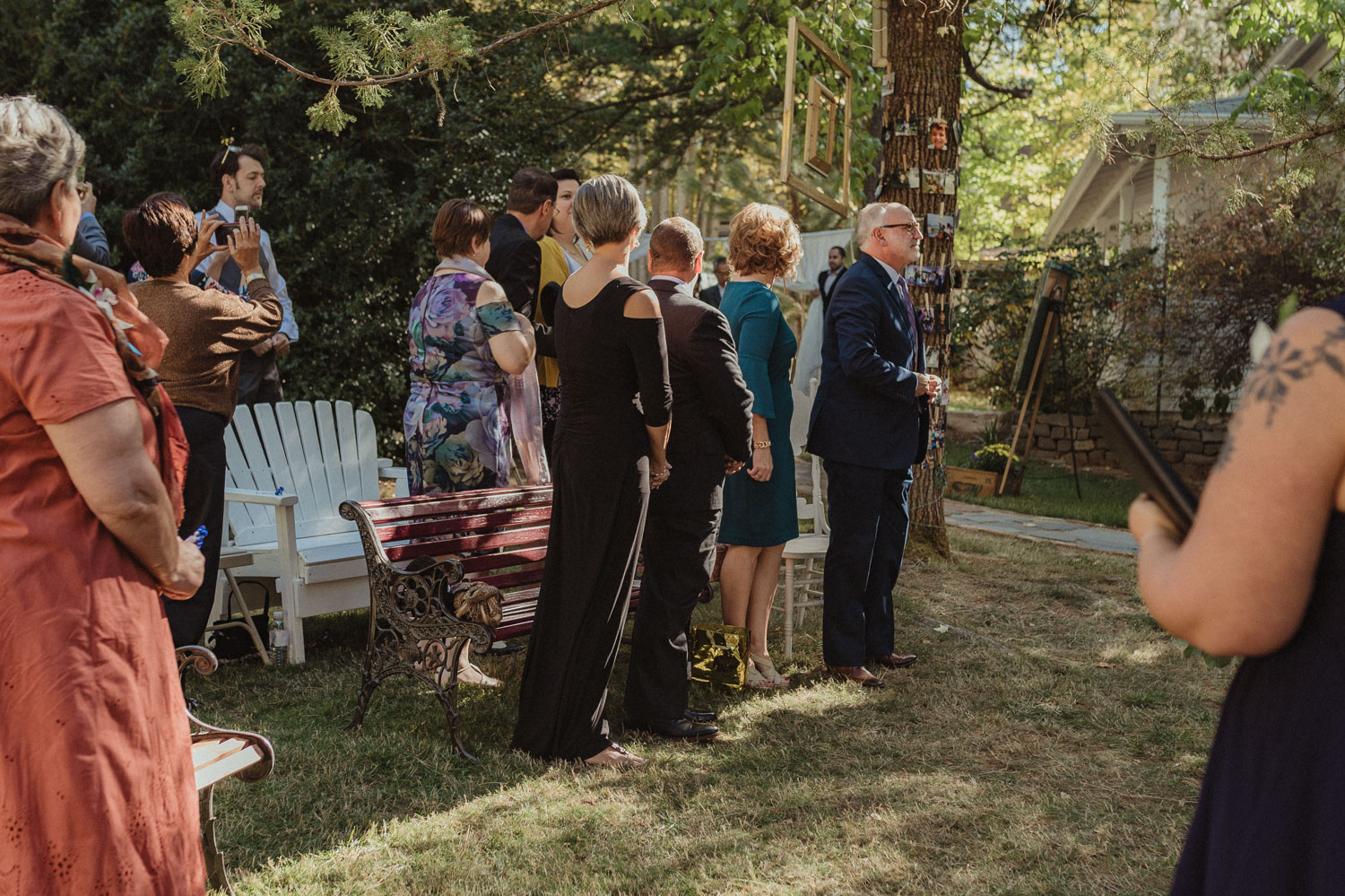 Nevada City wedding guests standing up for the bride photo