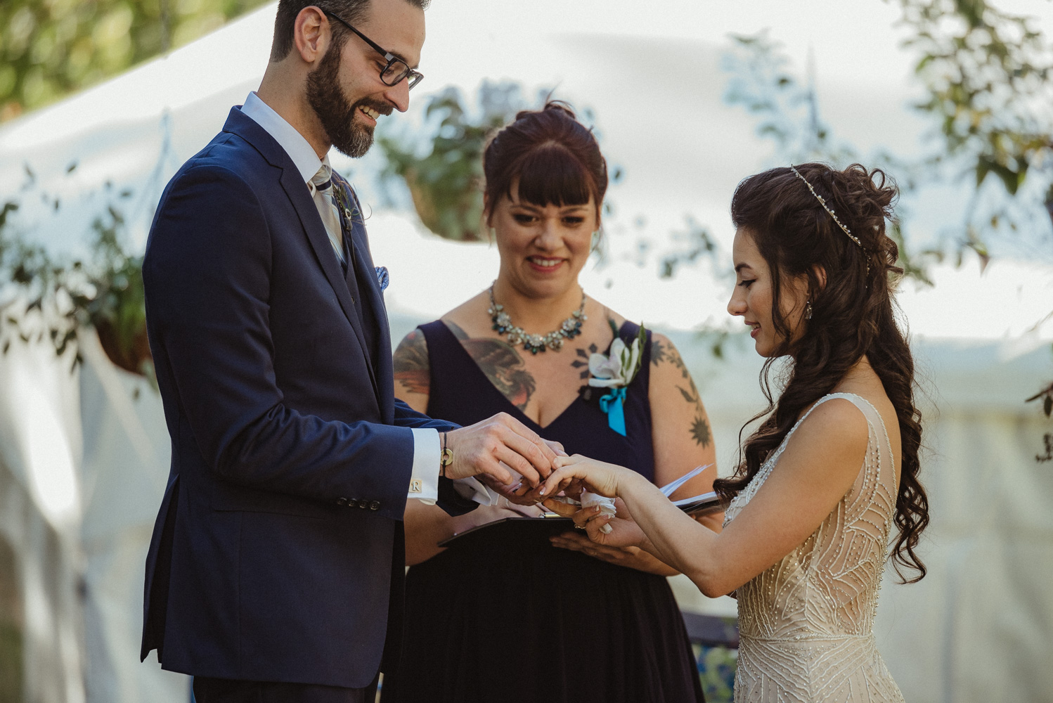 Nevada City wedding exchanging rings photo