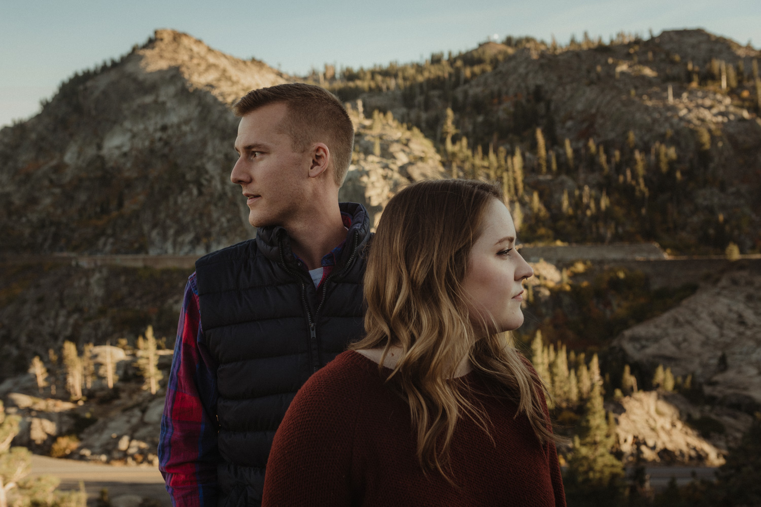 Donner Pass, CA engagement session couple staring opposite directions photo