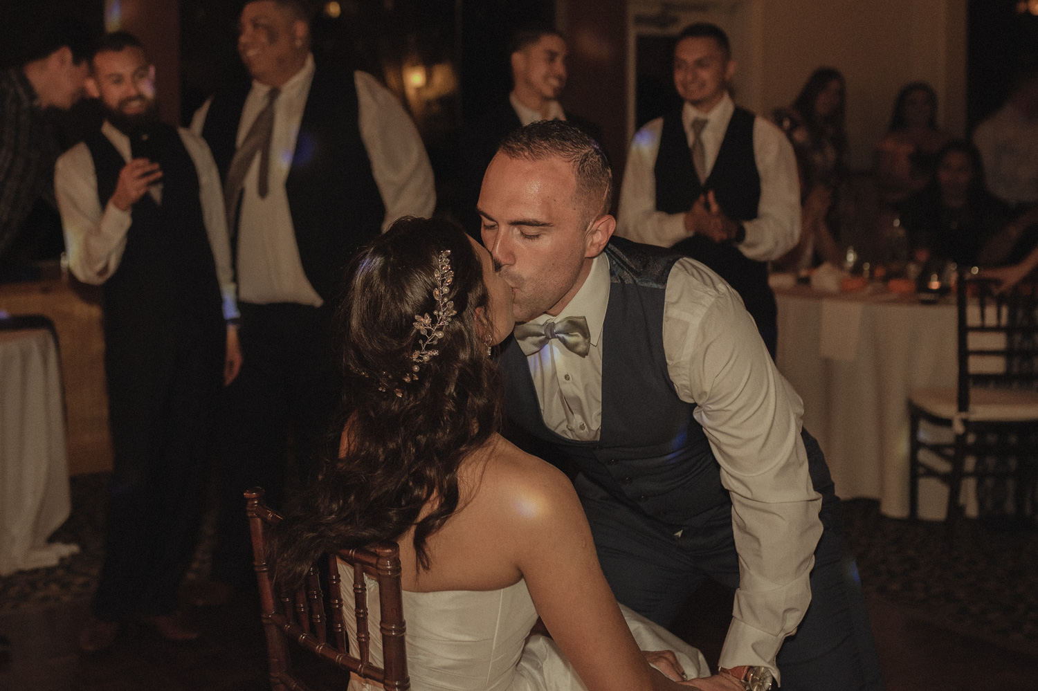 Tannenbaum Wedding Venue groom kissing his bride photo