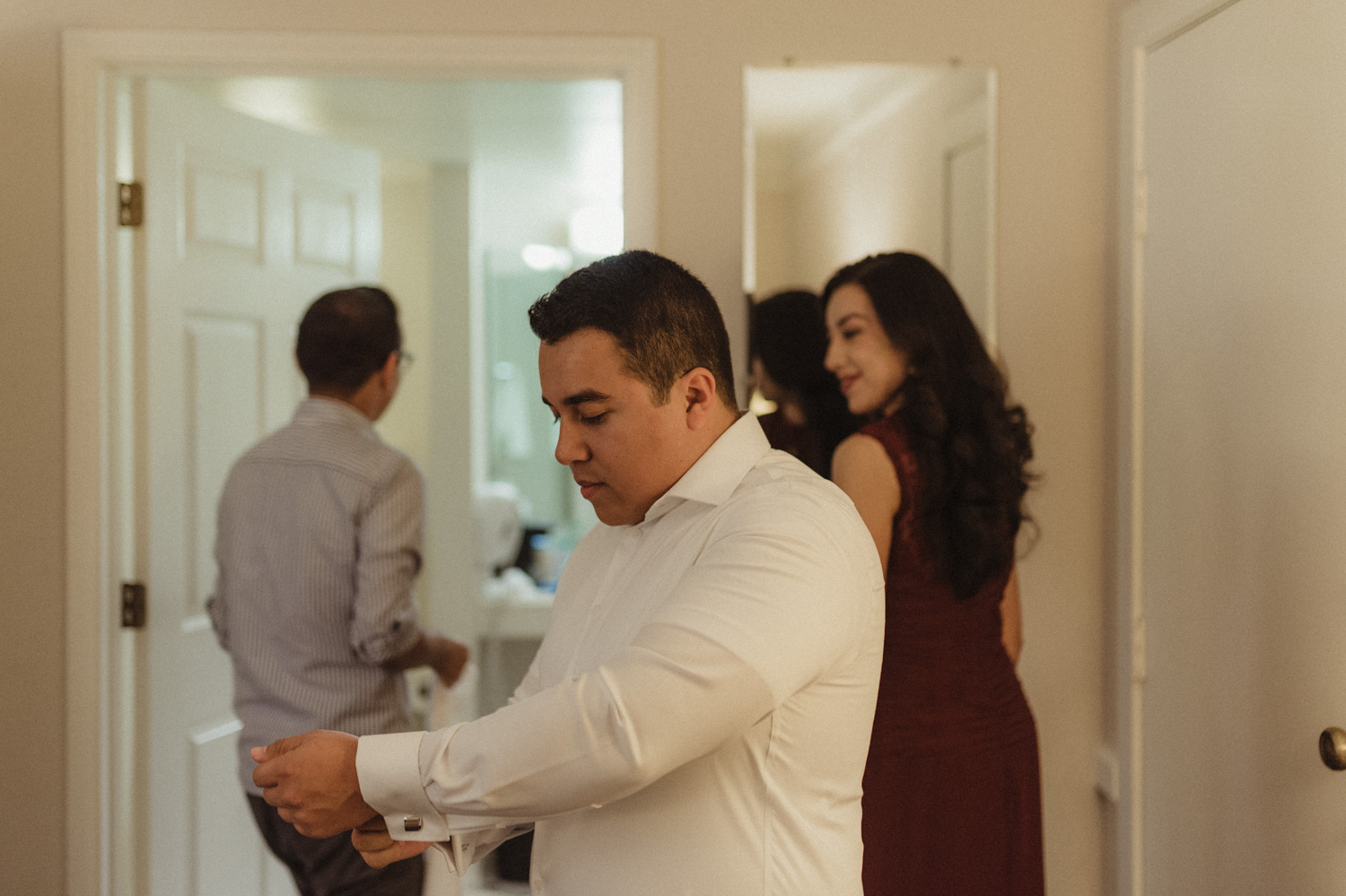 Logan Shoals elopement groom fixing his cuffs photo