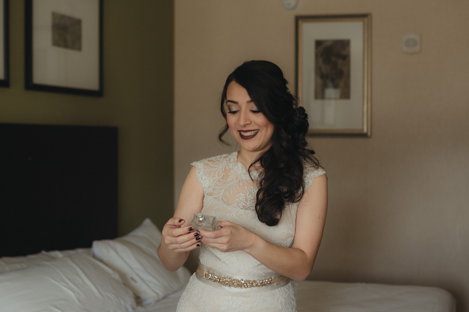 Logan Shoals elopement bride spraying on her perfume photo