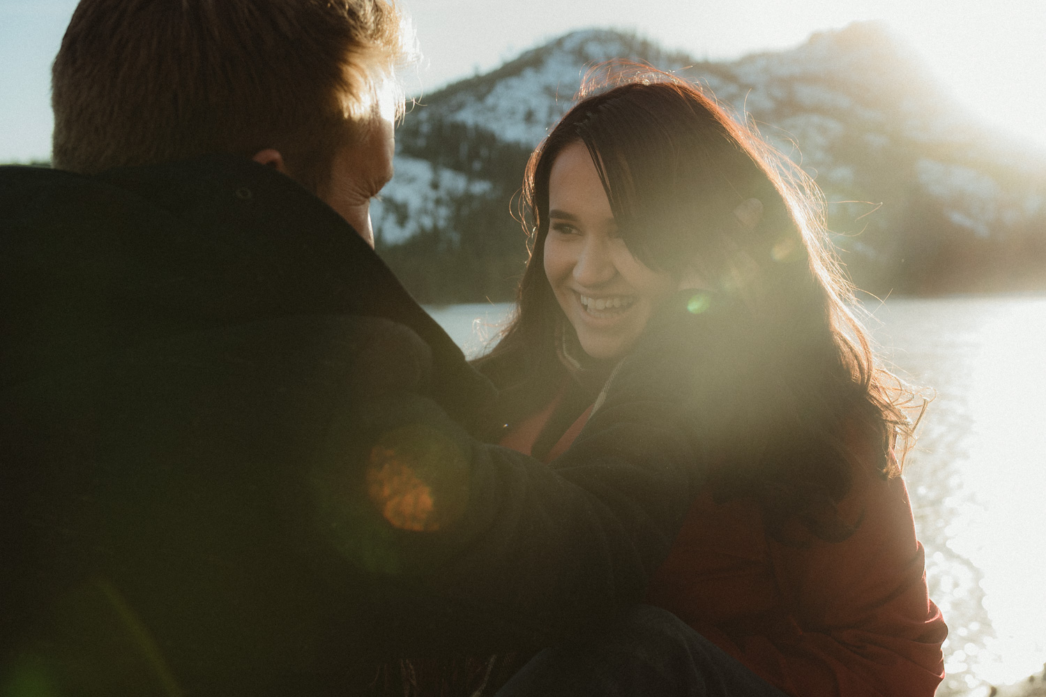 Engagement session by Donner Lake inspiration couple laughing together at the dock photo