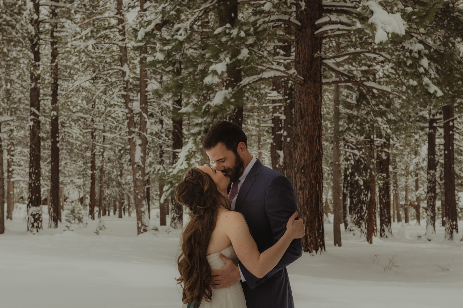Lake Tahoe winter wedding couple kissing photo