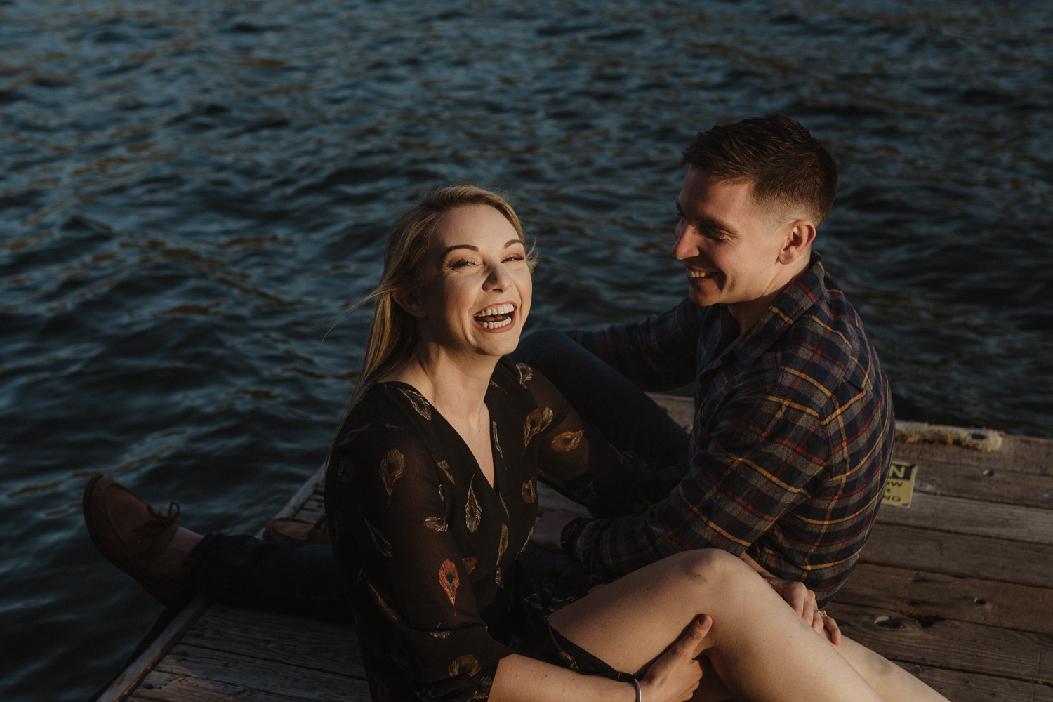 lake tahoe engagement photographer couple laughing together photo