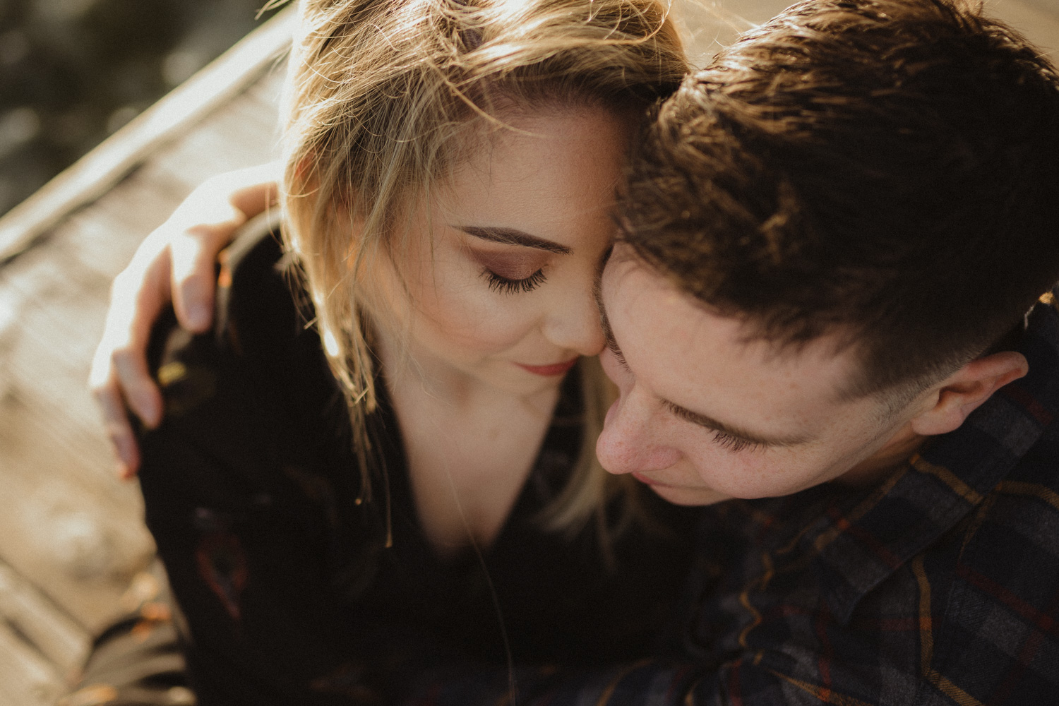 lake tahoe photographer, couple snuggling on the dock photo