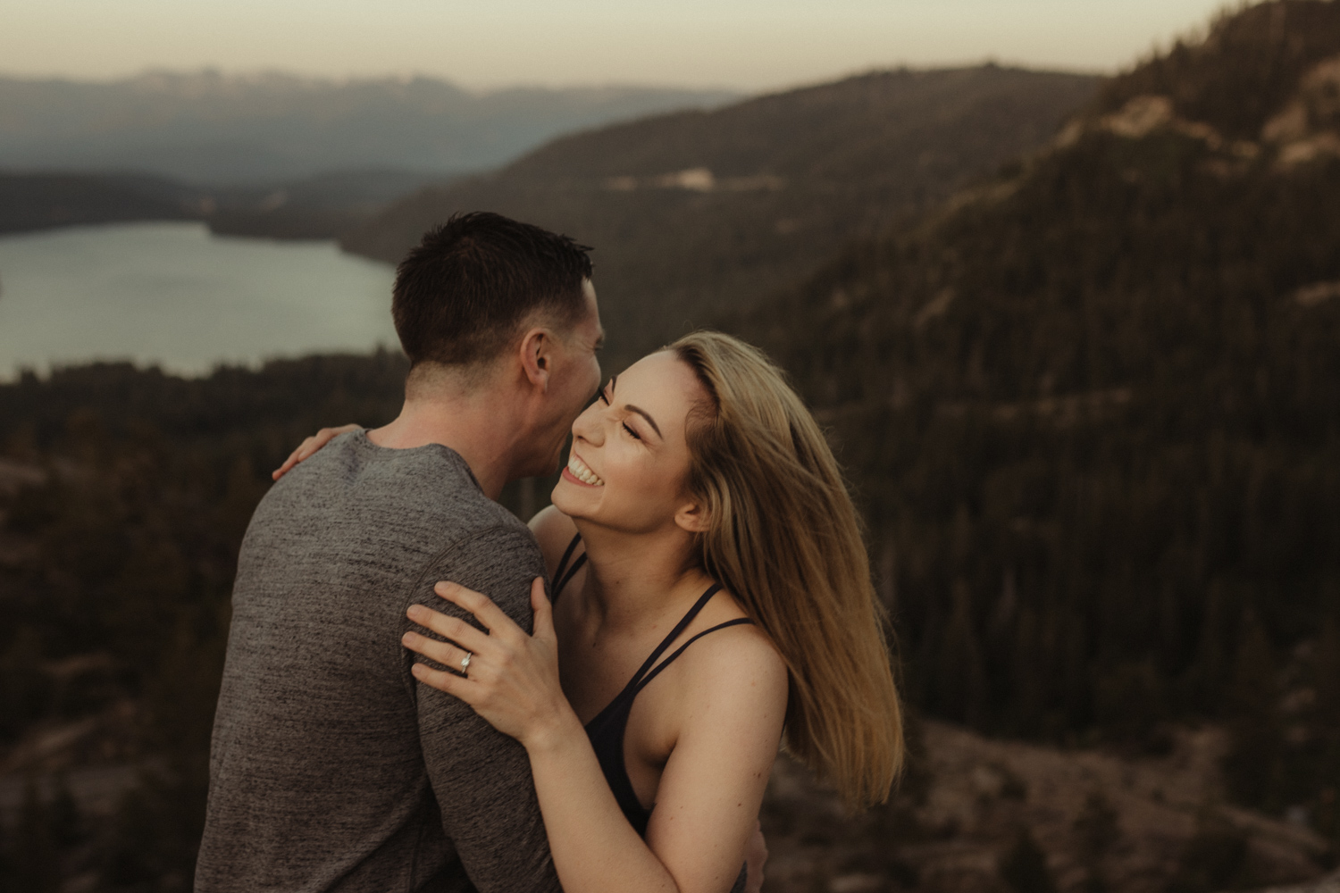 Lake tahoe photographer, moody photo of a couple laughing candidly 