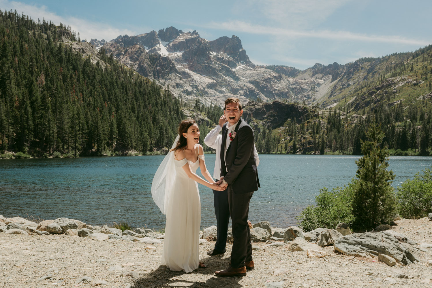 Elopement in the sierras photo, couple holding hands during the ceremony photo