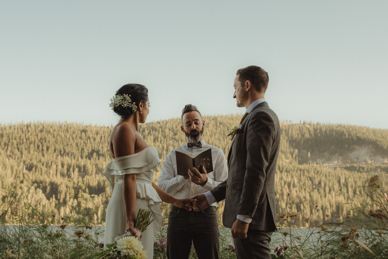 Lake Tahoe pop-up wedding/elopement couple exchanging vows photo