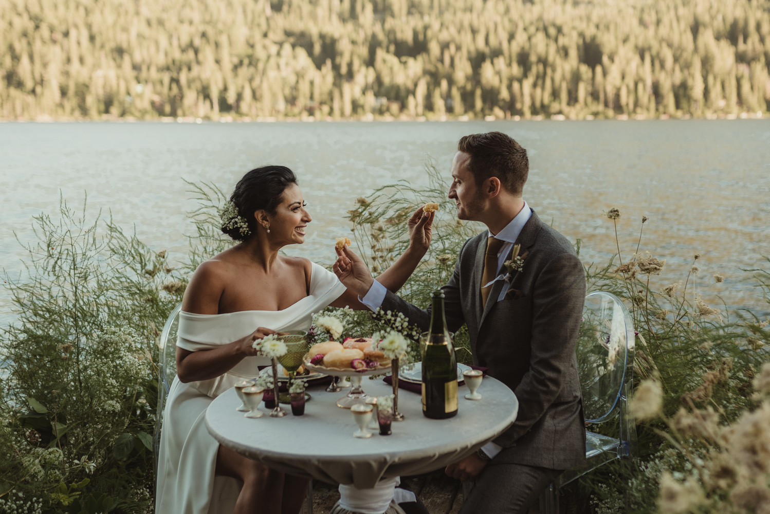 Lake Tahoe pop-up wedding/elopement couple enjoying dessert at their sweetheart table