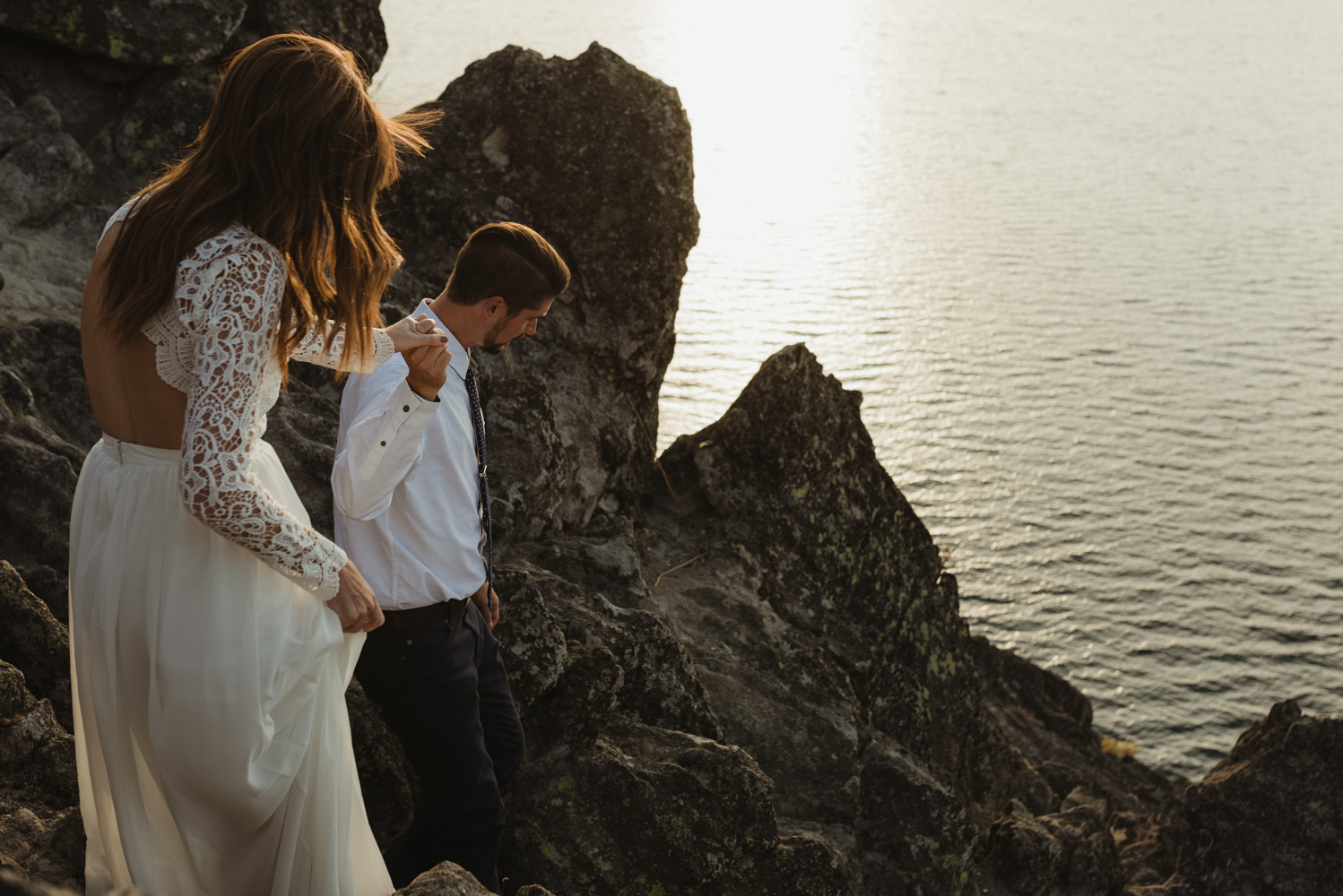 Lake Tahoe vow renewal couple walking down a cliff in Tahoe photo