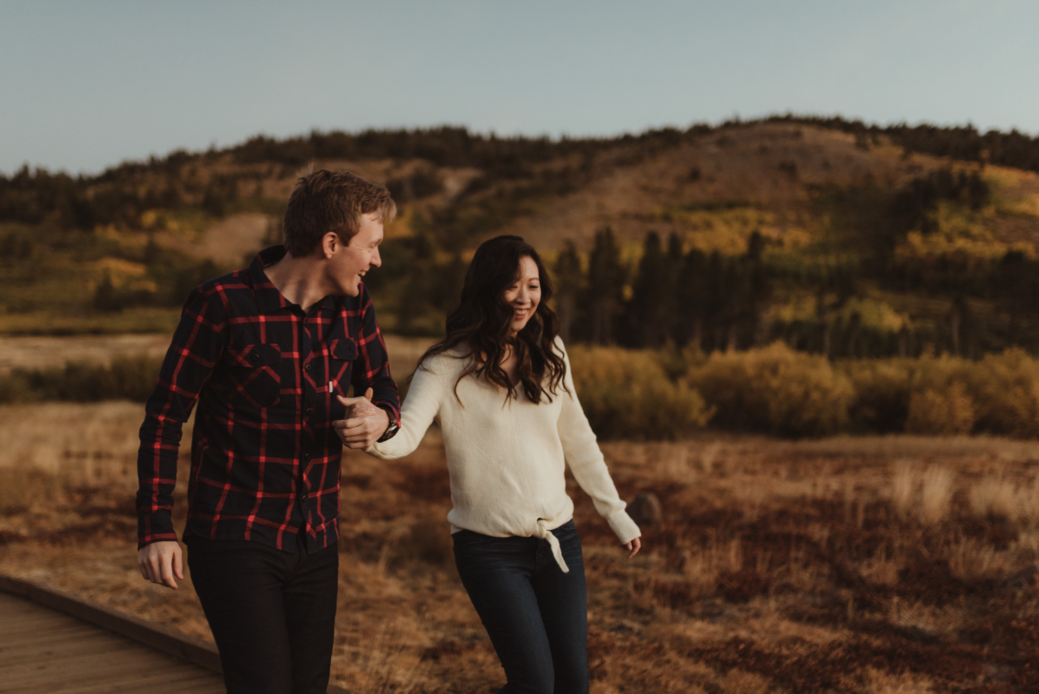 Tahoe meadows interpretive loop romantic sunrise session couple walking on a boardwalk photo