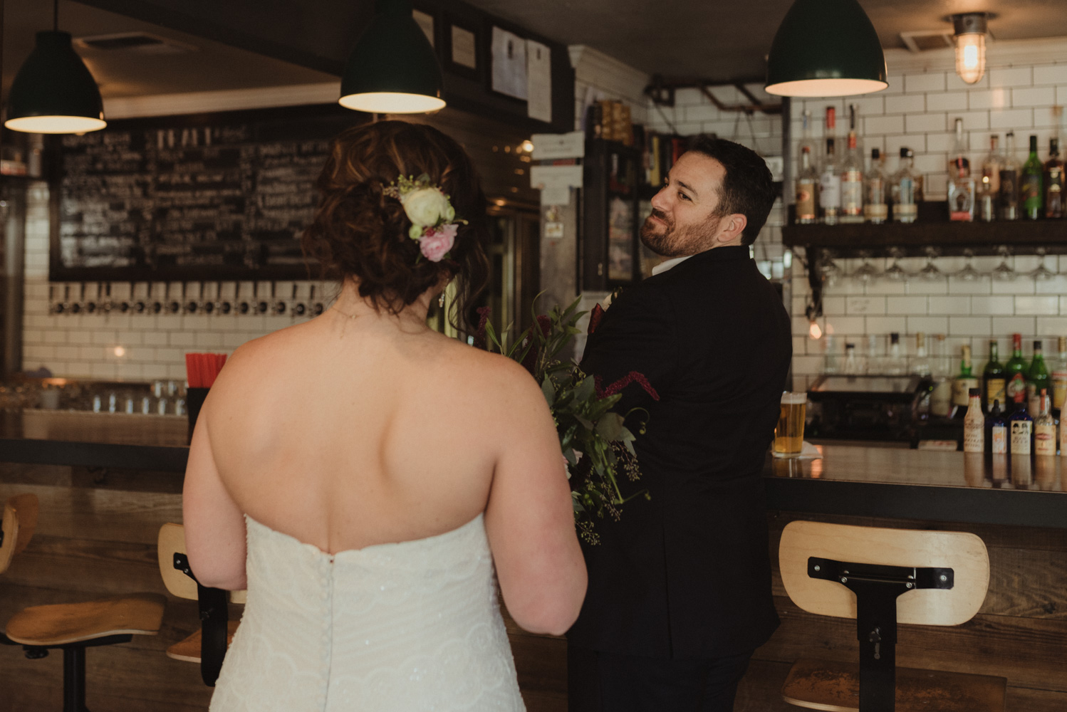 first look at a bar wedding photo