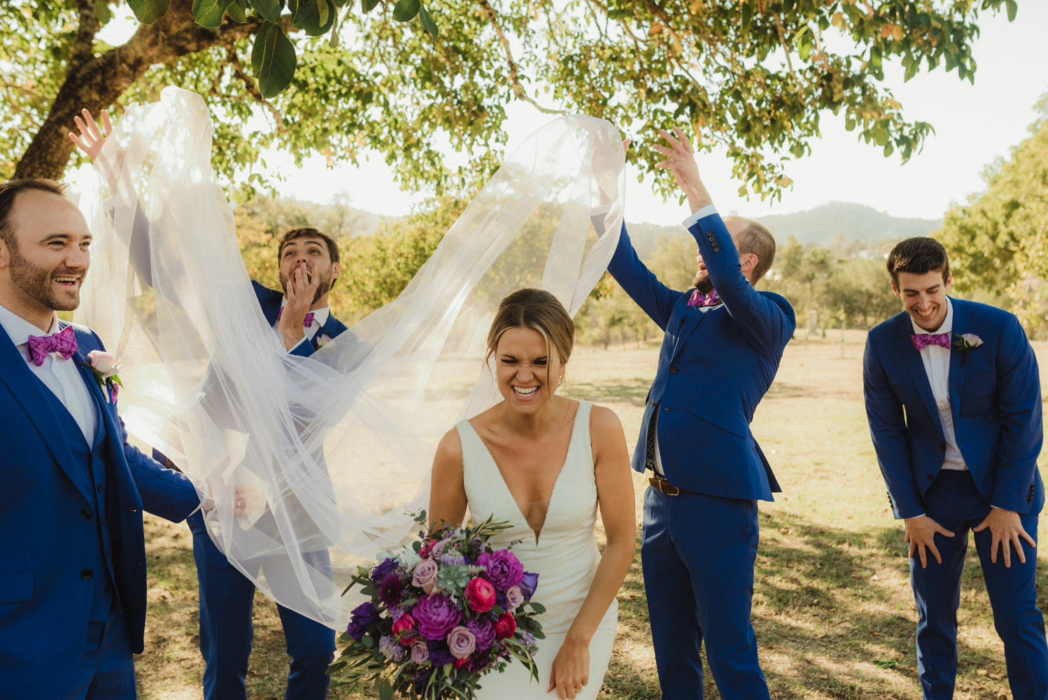 Triple S Ranch Wedding Venue, bride with groomsmen photo