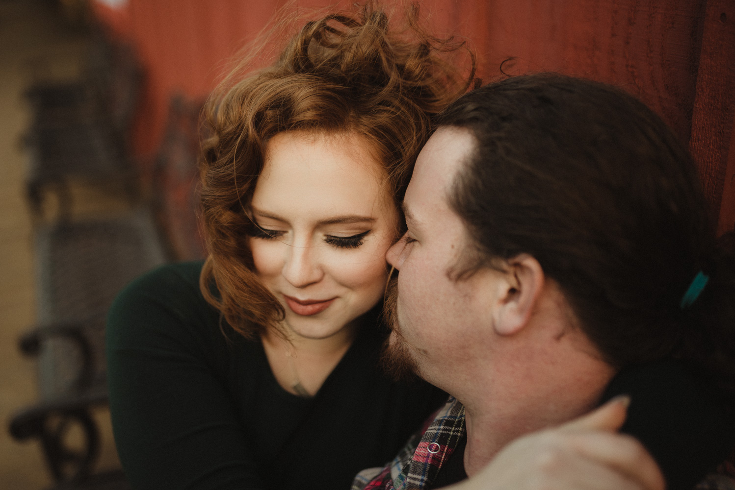 Virginia City Engagement session, couple cuddling on a bench photo