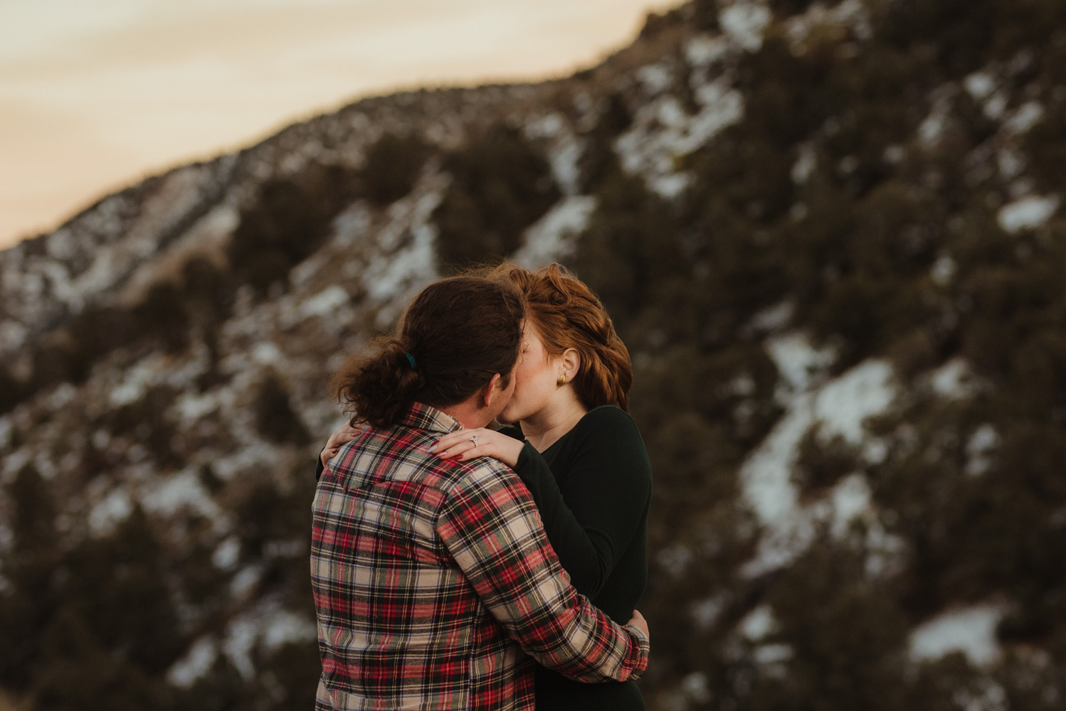 6 mile canyon engagement session, couple kissing during sunset photo
