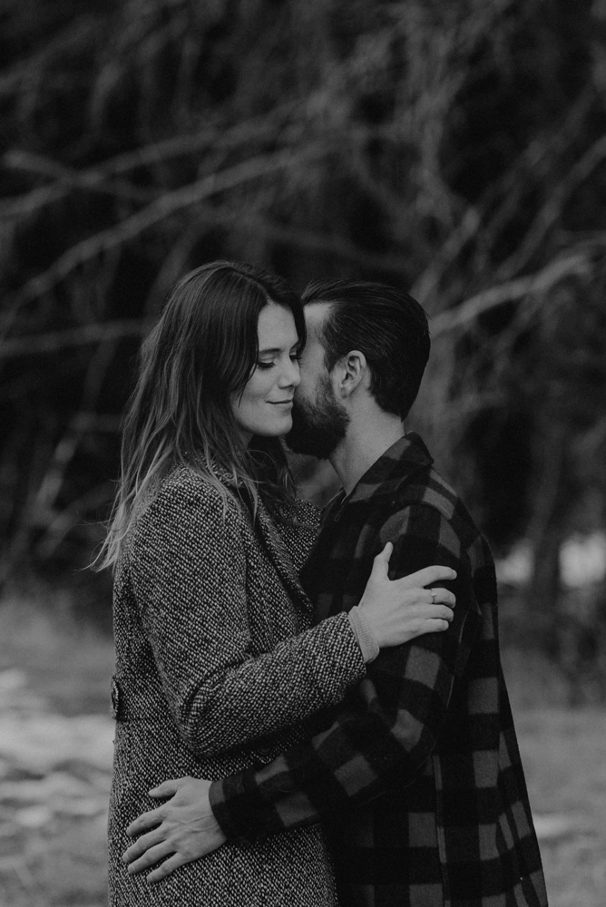 Strawberry California engagement session, couple hugging in the meadows, black and white photo