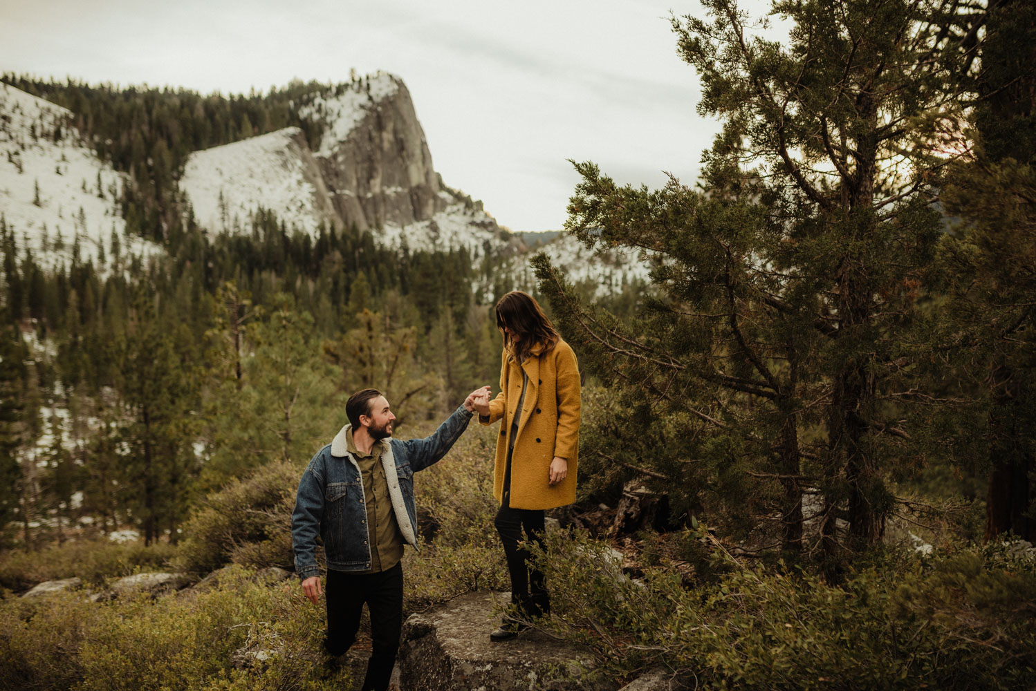 Lovers Leap engagement session couple standing in front of lovers leap photo