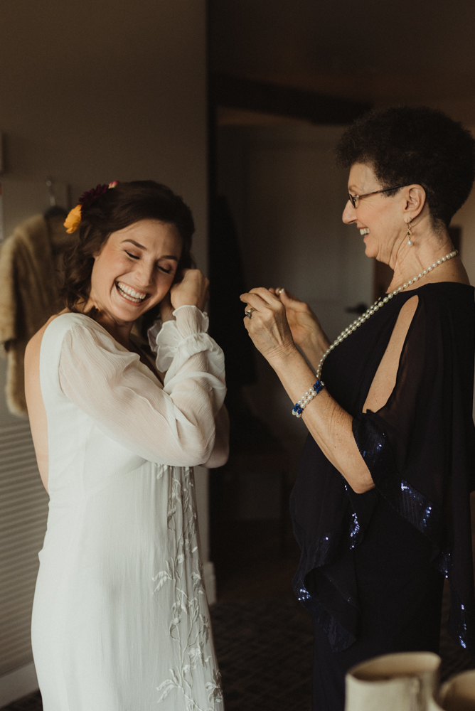 Emerald Bay Elopement, bride putting on her earrings photo 