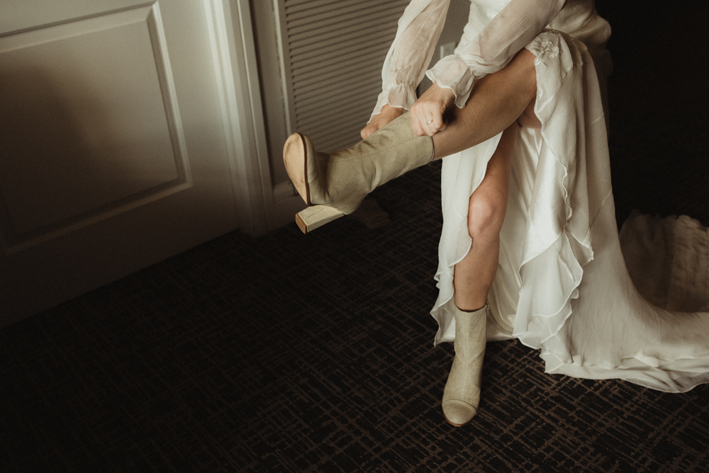 Emerald Bay Elopement, bride putting on her shoes photo