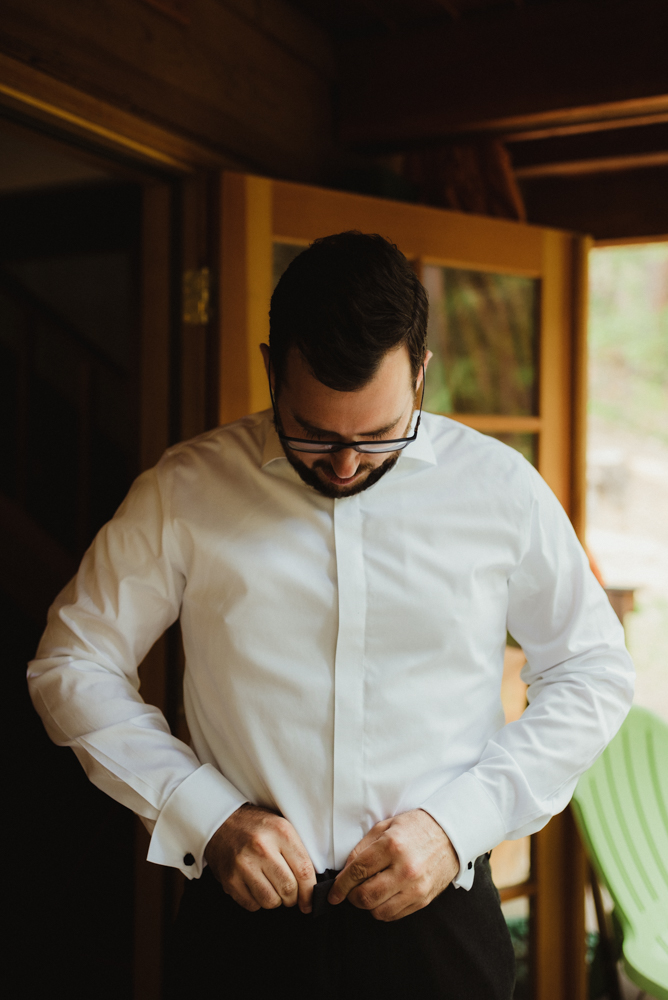 Twenty Mile House Wedding, photo of groom putting on his pants photo