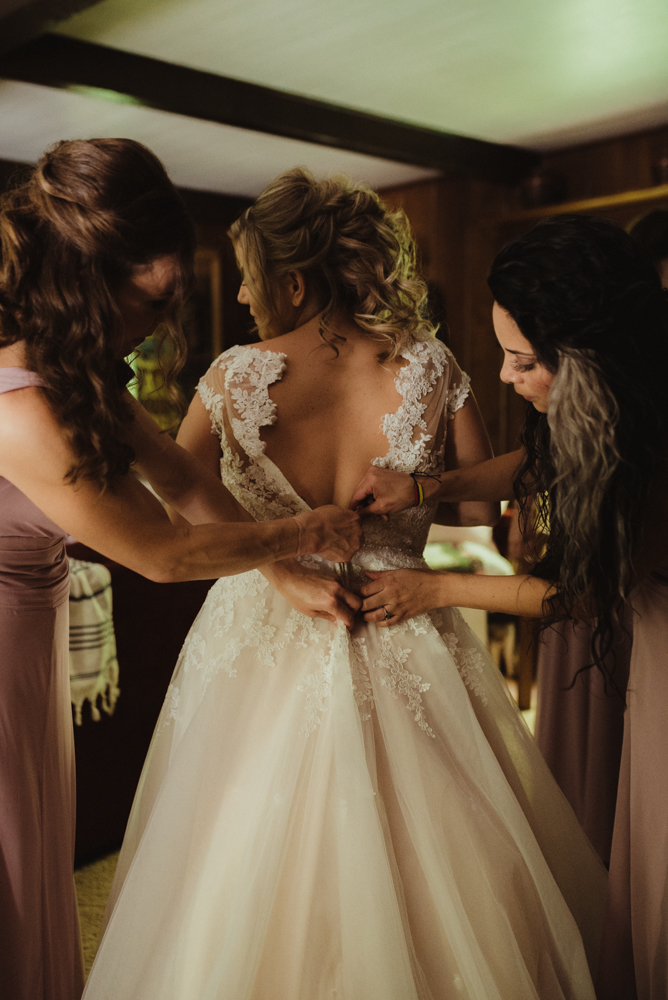 Twenty Mile House Wedding, photo of bride putting on her dress photo