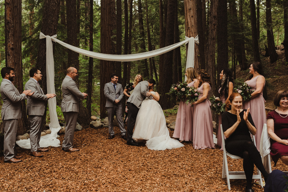 Twenty Mile House Wedding, photo of couple kissing under a white fabric arch