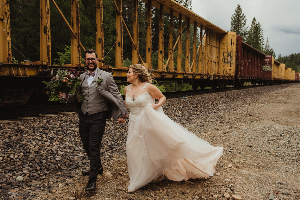 Twenty Mile House Wedding, photo of couple running by a train