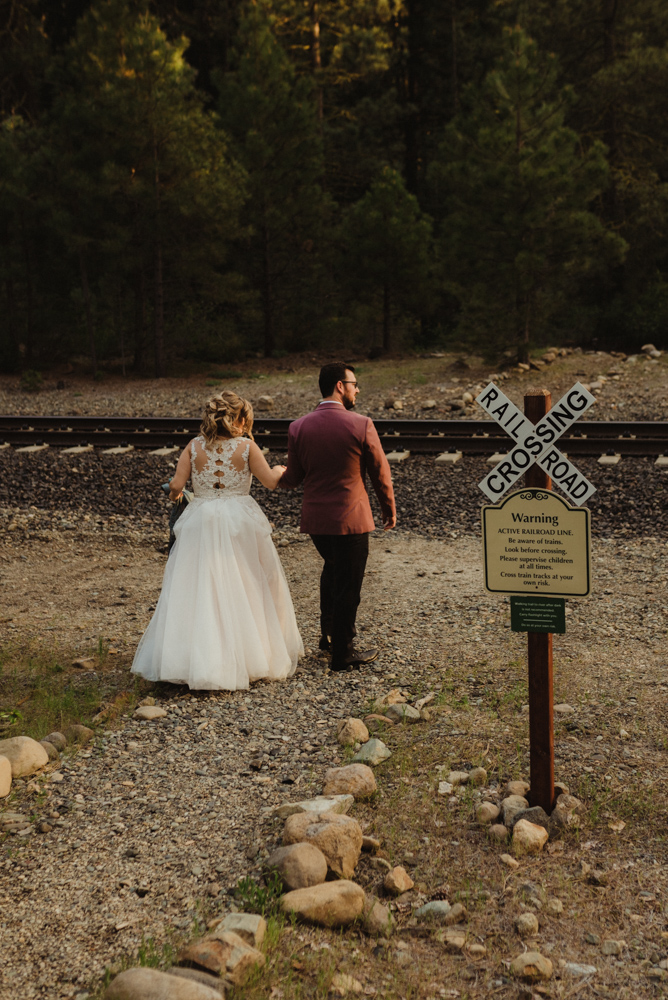 Twenty Mile House Wedding, photo of couple crossing the railroad 