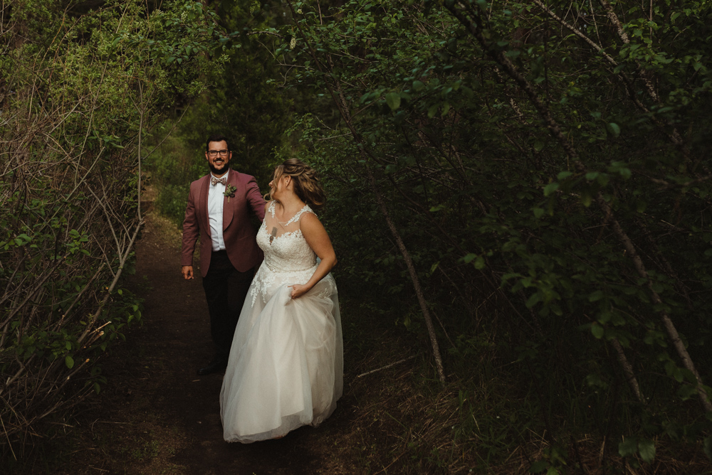 Twenty Mile House Wedding, photo of bride walking through the forest 