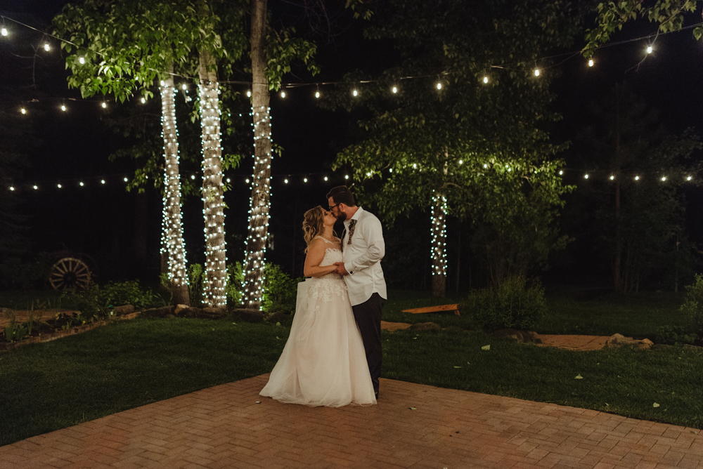 Twenty Mile House Wedding, photo of couple with string lights 