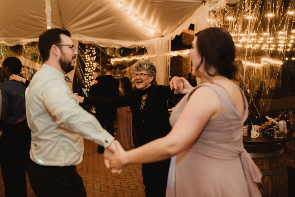 Twenty Mile House Wedding, photo of groom dancing with his sister and mom