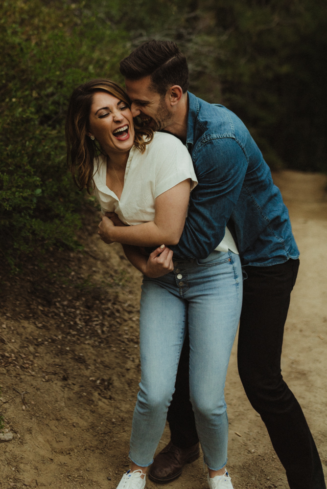 Lake Tahoe Engagement session, couple laughing together on a tahoe trail 