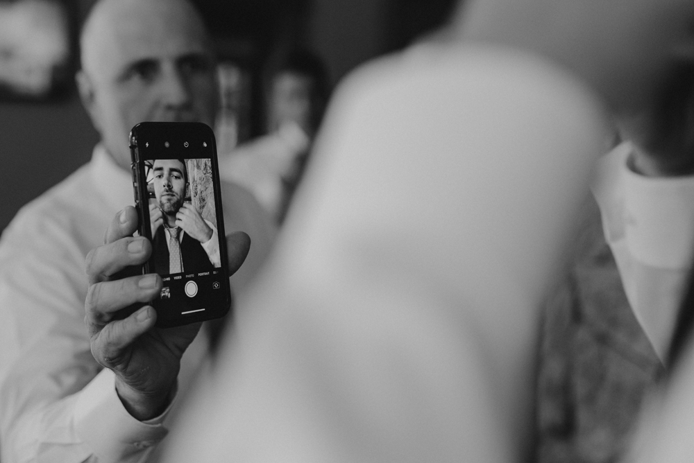 Martis Camp Wedding-using your phone as a mirror photo