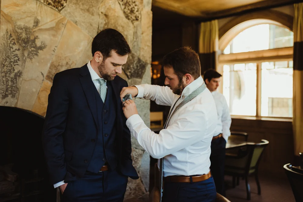 Martis Camp Wedding, groomsmen helping groom photo