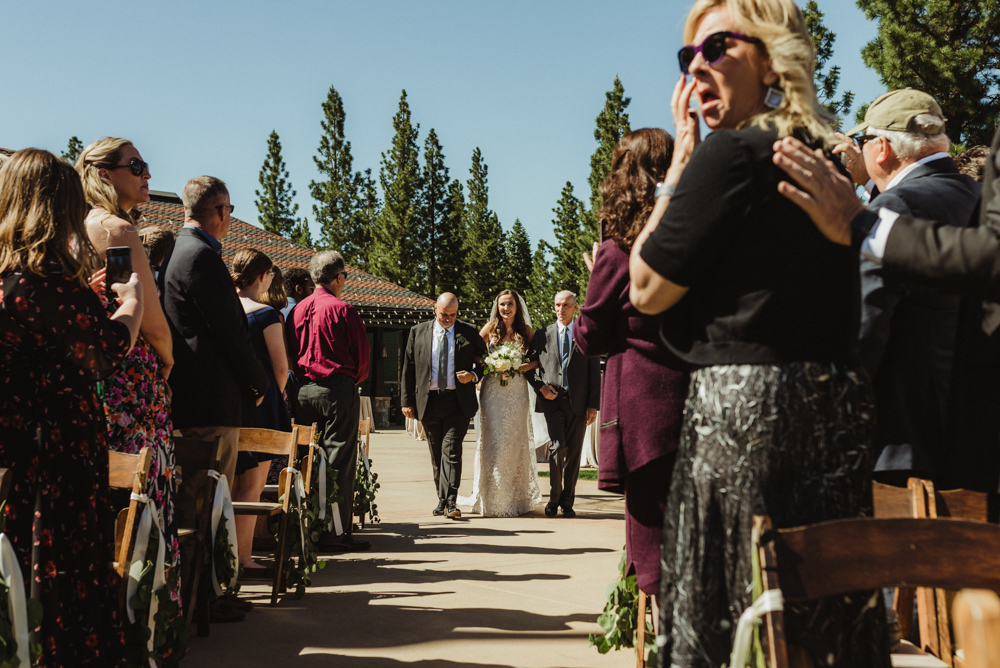 Martis Camp Wedding, bride walking down the aisle with her father and step-dad photo